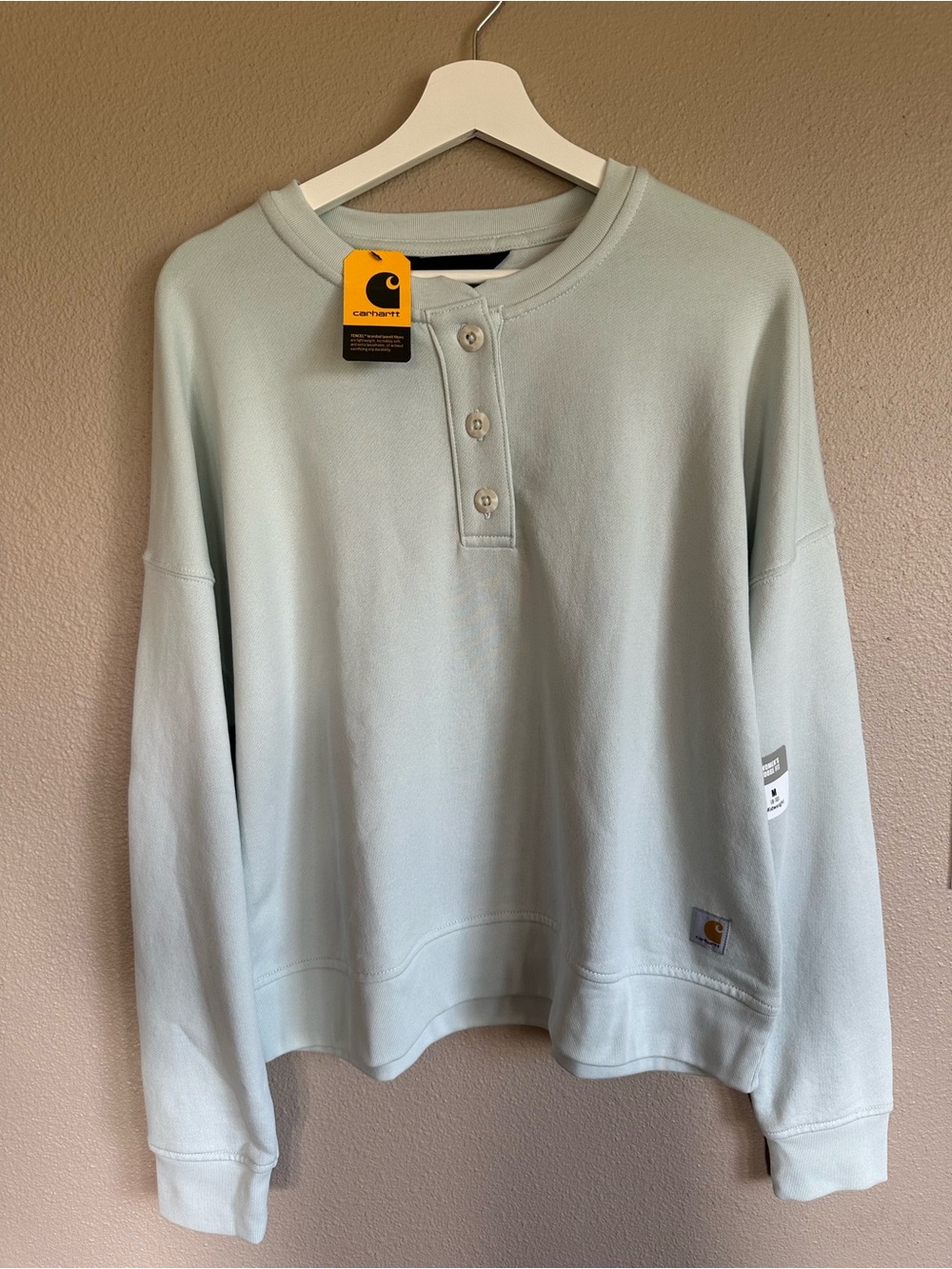 Carhartt women’s Loose fit mid weight French Terry Henley sweatshirt, cream blue